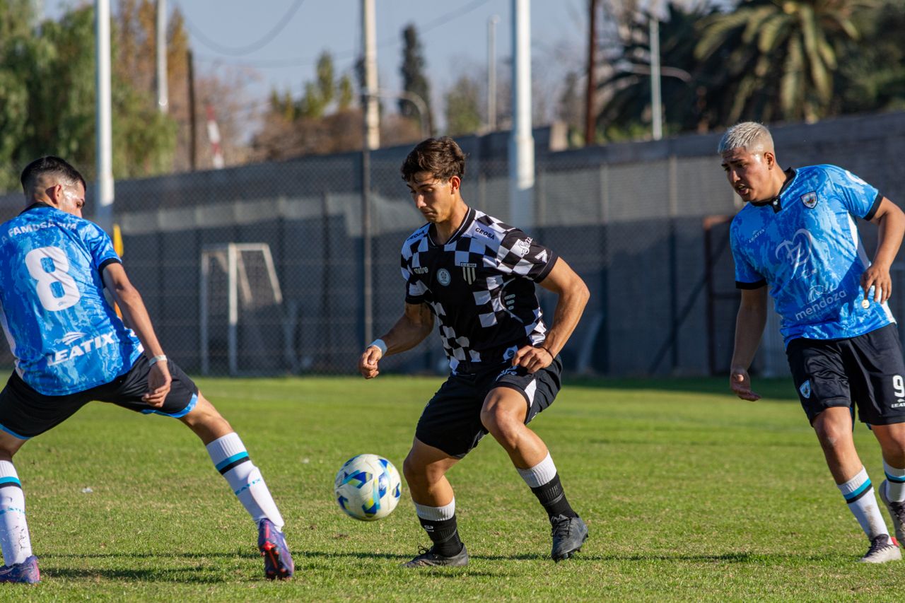 Crafting Captivating Headlines: Your awesome post title goes here Three football players in action during a sunny outdoor match, showcasing athleticism and teamwork.